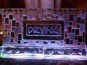 8 foot Drink Bar with Drynk Logo, we made the colored tiles on the face of the bar match their event colors. Cans of beer frozen into base