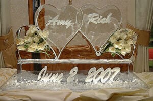2 hearts side by side with white roses, names and date on base