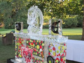Myopia Club 8 ft ice bar with horse head drink luge, freeze-ins of rackets and tennis balls.e