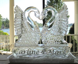 Kissing Swans with Bride and grooms name at base this is a large 2.5 block sculpture