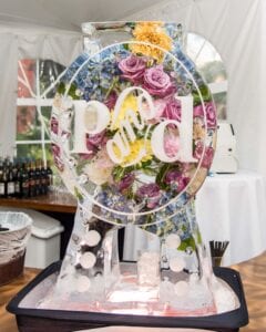 Drink luge with fresh flowers to match brides bouquet.