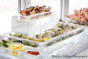 Our Standard Raw Bar close up. The ice server with the crab claws in it can be substituted for a logo or sculpture of your choice