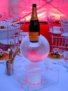 Sphere ice sculpture to hold bottle